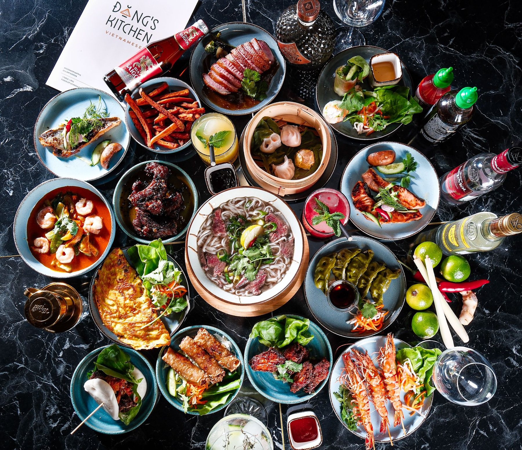A full table of Vietnamese dishes shared family style