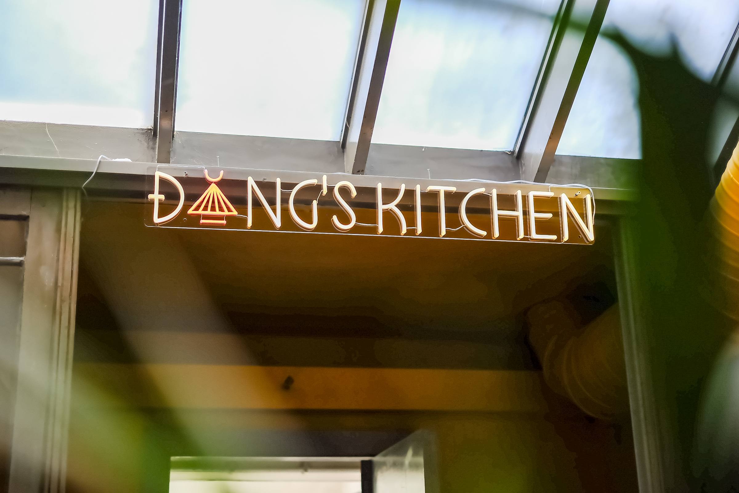 The Dang's Kitchen neon sign above the entrance