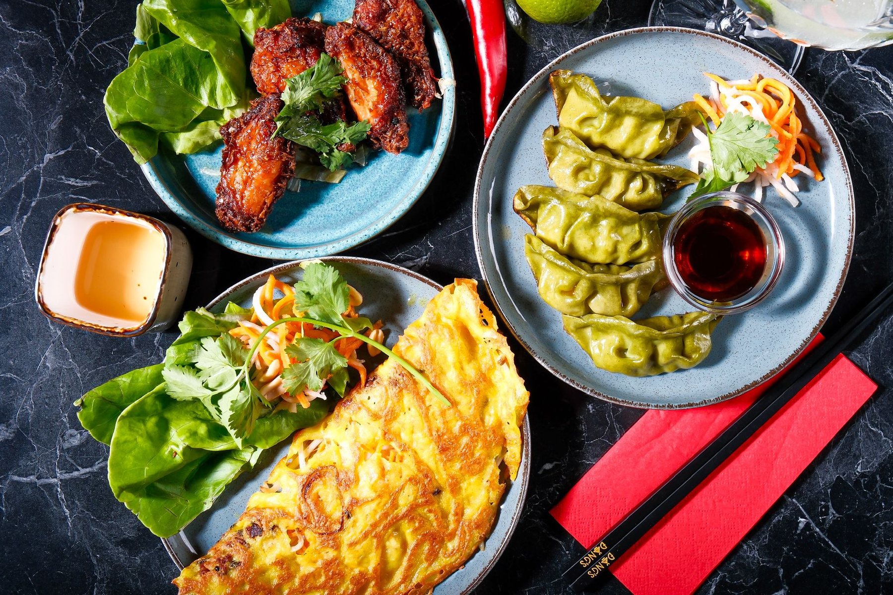 Asian tapas: dumplings, chicken wings and crêpe